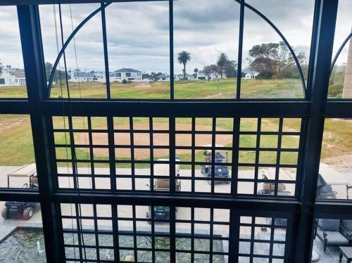 a view from a window of a parking lot at Shelley On Sea in Stompneusbaai