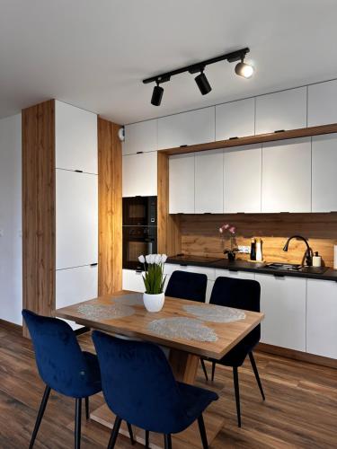 Η κουζίνα ή μικρή κουζίνα στο Apartamenty FIGARETTI