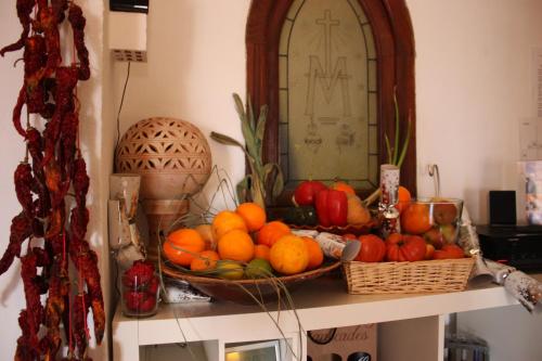 a bowl of fruit on top of a table at L'Almàssera Casa Rural & Restaurant in Margarida