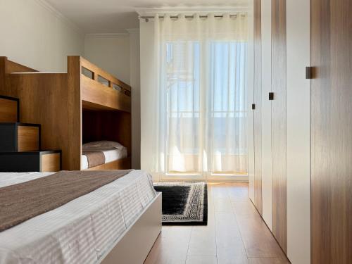 Postel nebo postele na pokoji v ubytování Luxury Seaview Apartments - by EKA Luxury Apartments