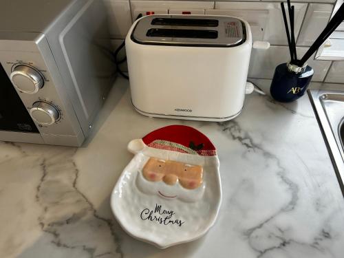 a santa claus toy on a counter next to a toaster at Atlantic Sea View in Tralee