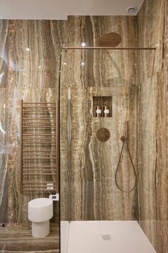 a bathroom with a shower and a toilet at Le XV Cannes in Cannes