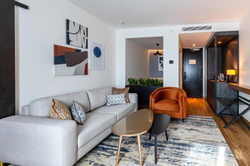 a living room with a couch and a table at Crowne Plaza Belgrade by IHG in Belgrade