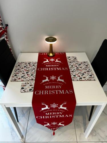 a table with a red christmas scarf on it at Atlantic Sea View in Tralee