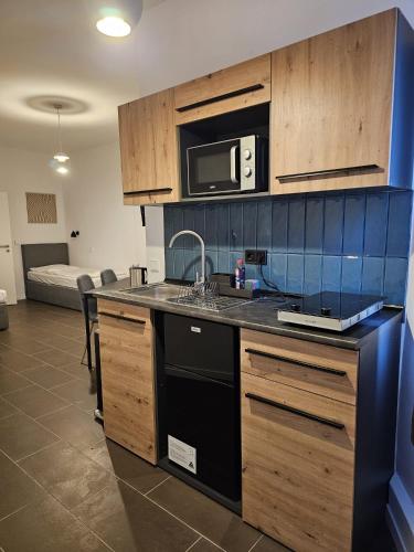 Η κουζίνα ή μικρή κουζίνα στο ApartHotel Slumber 24h Self Check in