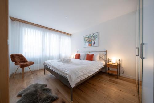 Postel nebo postele na pokoji v ubytování Galerie Obersee 3E - Top Lage - by Arosa Stay