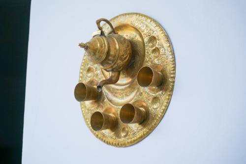 a gold object with a bug on it at RIAD AMR in Tangier
