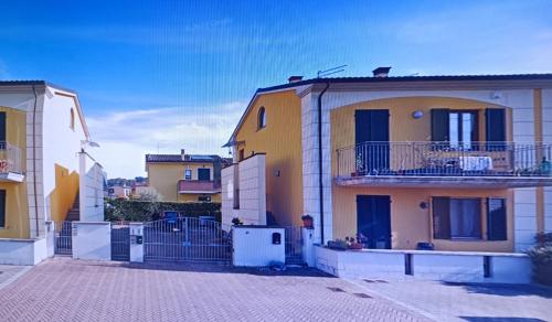 a group of houses in a city at Teddy House in Porcari