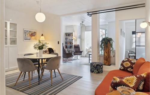 a living room with a table and chairs at One-Bedroom Apartment In Stege in Stege