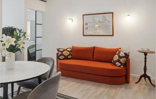 a living room with a couch and a table at One-Bedroom Apartment In Stege in Stege