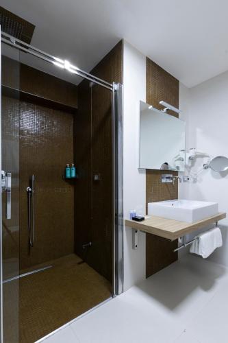 a bathroom with a shower and a sink at Hotel Royal Caserta in Caserta