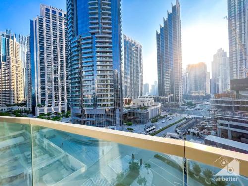 a view of a city from the balcony of a building at Luxury & Elegance in Downtown Fountain Views in Dubai