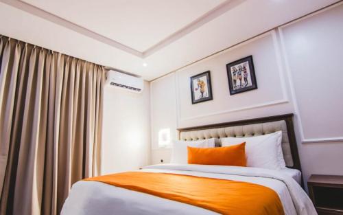 Ένα ή περισσότερα κρεβάτια σε δωμάτιο στο Misan Hotel Lekki Phase 1