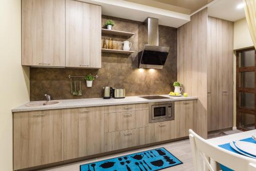 Η κουζίνα ή μικρή κουζίνα στο Raugyklos apartamentai