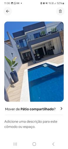 Kolam renang di atau dekat dengan Suíte em casa familiar de luxo com piscina em Itaipu