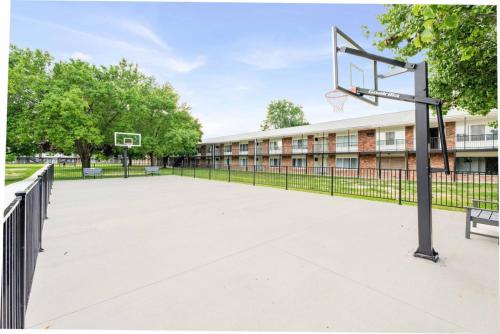 an outdoor basketball hoop in front of a building at Central Home and Serene WiFi Pet Friendly in Sterling Heights