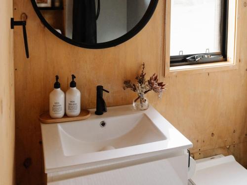 a bathroom with a sink and a mirror at Heyscape Denmark in Denmark