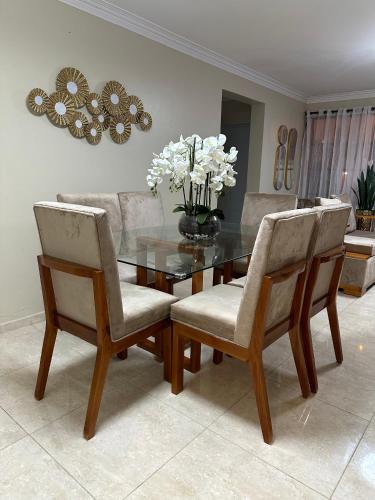 a dining room with a glass table and chairs at Don Fernando in Santiago de los Caballeros