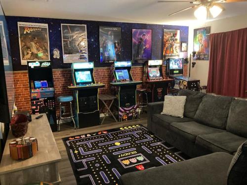a living room with a couch and a bunch of computers at Hidden Haven in Canyon Lake