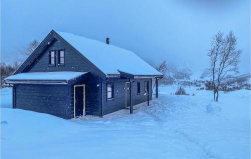 a small house with snow on top of it at Lovely Home In Vikeså With Kitchen in Vikeså