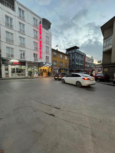 a white car parked in front of a building at Garra Hotel in Konya