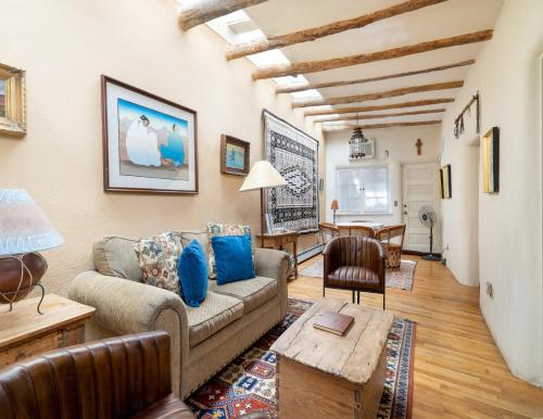 a living room with a couch and a table at Harmony House in Santa Fe