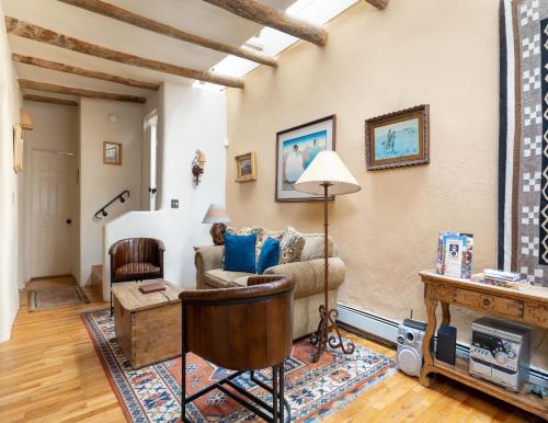 a living room with a couch and a table at Harmony House in Santa Fe