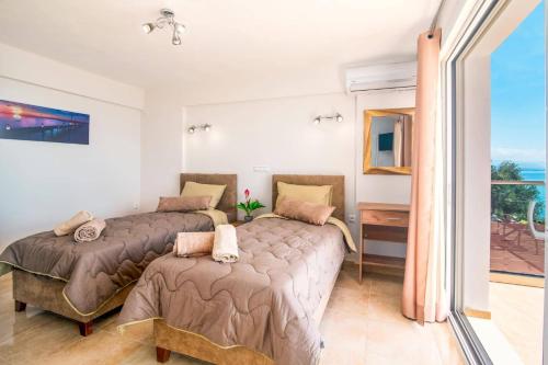 Posteľ alebo postele v izbe v ubytovaní Villa Poseidon Seaside by Villa Plus
