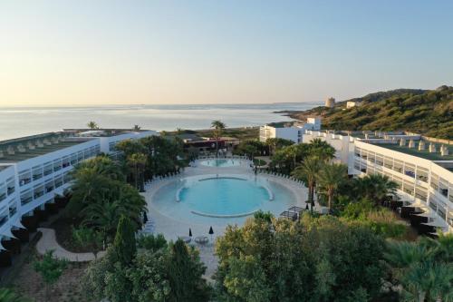an aerial view of a resort with a swimming pool at Grand Palladium Select Palace Ibiza - All Inclusive in Playa d'en Bossa