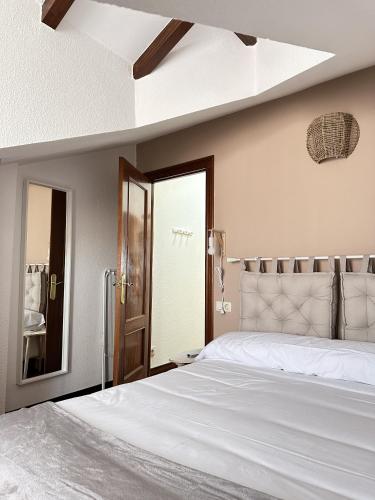 Ένα ή περισσότερα κρεβάτια σε δωμάτιο στο Apartamentos Val de Comillas