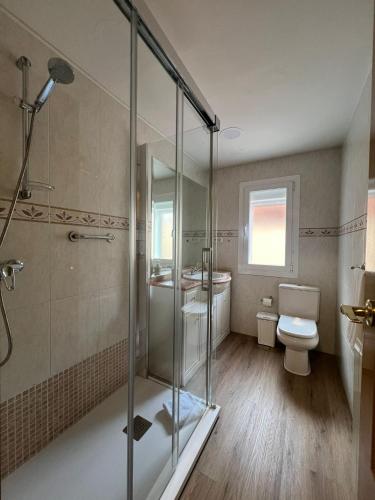 a bathroom with a shower and a toilet and a sink at Hello Madrid in Madrid