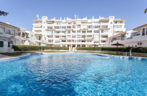 a large swimming pool in front of a building at Vistahermosa Piscina Vistas in El Puerto de Santa María
