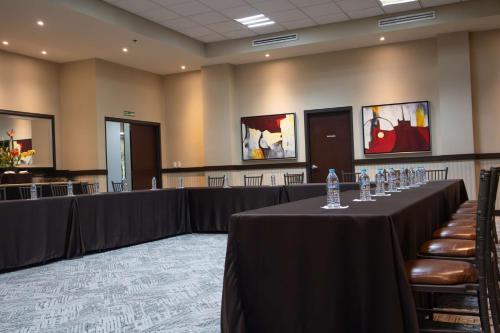 a conference room with tables and chairs in it at Best Western PREMIER Monterrey Aeropuerto in Monterrey