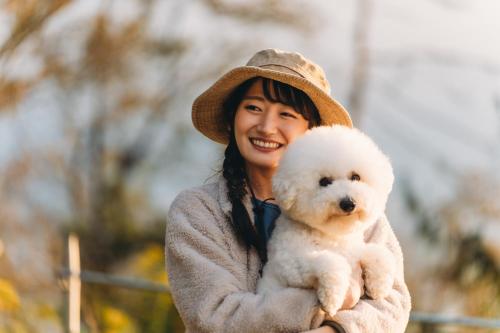 a woman holding a white teddy bear at Kita Karuizawa Morino Takibi Dogs OK! in Tsumagoi