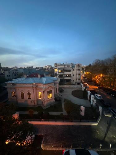 a view of a building in a city at night at Hotel EvoZava Central in Bucharest