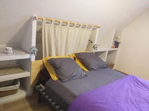 Postel nebo postele na pokoji v ubytování GITE DANS VIGNOBLE ALSACIEN