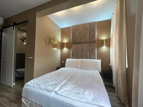 Ένα ή περισσότερα κρεβάτια σε δωμάτιο στο Trento best home