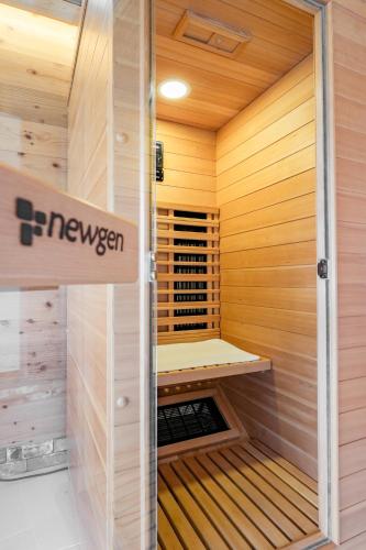 a wooden sauna with a sign that reads newezez at Kita Karuizawa Morino Takibi Pool Villa with Sauna in Tsumagoi