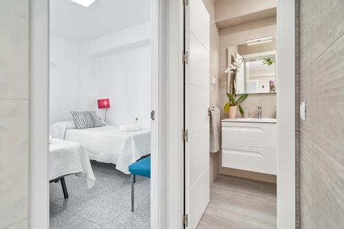 Ένα ή περισσότερα κρεβάτια σε δωμάτιο στο Molina 2