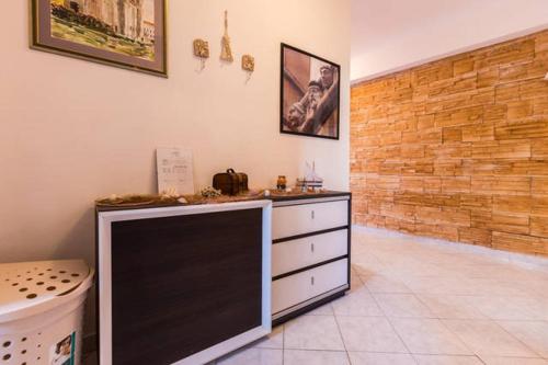 a kitchen with a counter and a dresser in a room at Apartment Grgo in Biograd na Moru