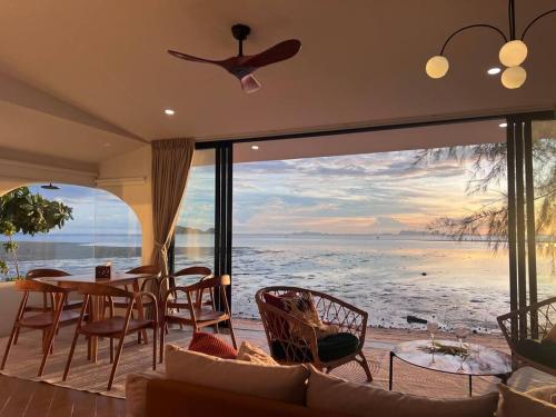 a living room with a view of the ocean at Villa seafront Baan Chom-Ley Boutique villa in Hinkong
