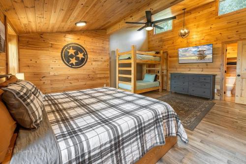 a bedroom with a bed and a bunk bed at Dolly's Lodge # 3 condo in Sevierville