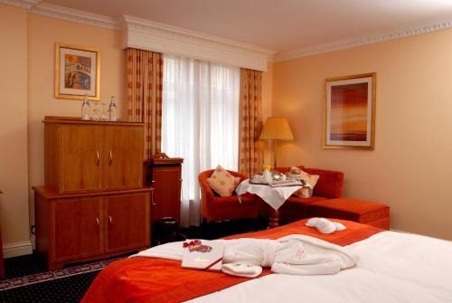 Postel nebo postele na pokoji v ubytování Park House Hotel