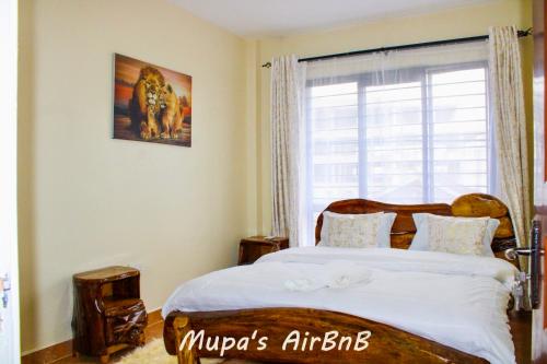 Postel nebo postele na pokoji v ubytování Mupa Luxury Condo III