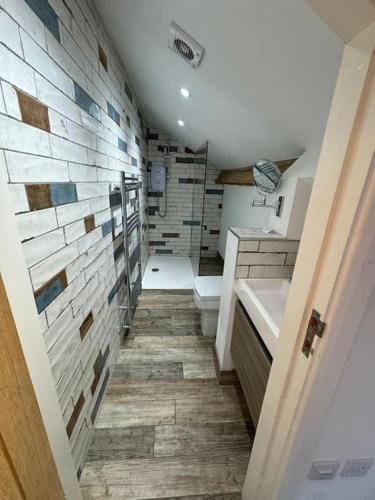 a bathroom with a toilet and a sink at Bounty On The Lakes in Bowness-on-Windermere