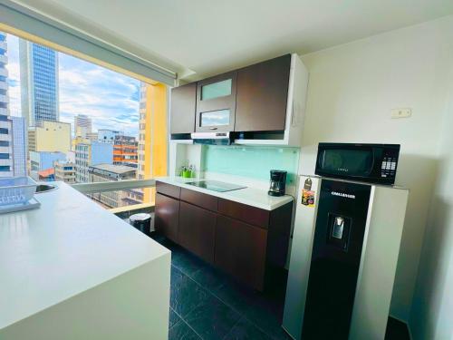 Kuchyň nebo kuchyňský kout v ubytování Aparta Suite Continental Bogotá