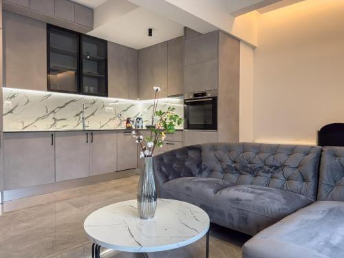 a living room with a couch and a table at VILLA 8 By ProLiving Hospitality in Thessaloniki