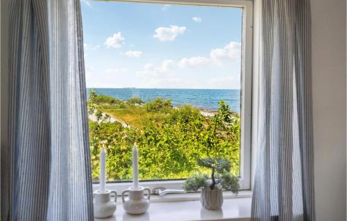 a window with a view of the ocean at 1 Bedroom Cozy Home In Mesinge in Mesinge