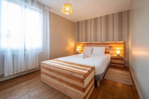 a bedroom with a large bed and a window at Casa Soma in Saint-Marcel