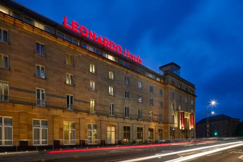 a building with a red sign on the top of it at Leonardo Hotel Edinburgh Haymarket in Edinburgh